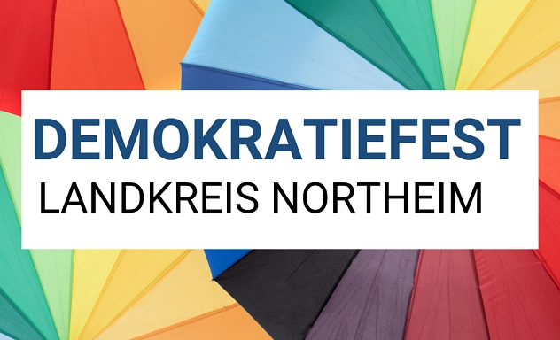 Vorschaubild Demokratiefest 2026 Bunte Regenschirme bilden den Hintergrund. In einem weißen Textfeld steht „Demokratiefest Landkreis Northeim“